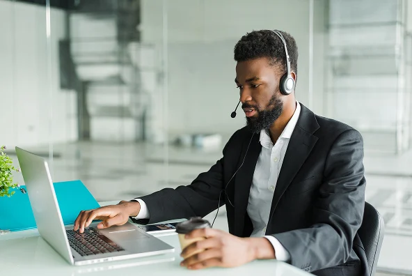 african-american-man-customer-support-operator-with-hands-free-headset-working-office 1